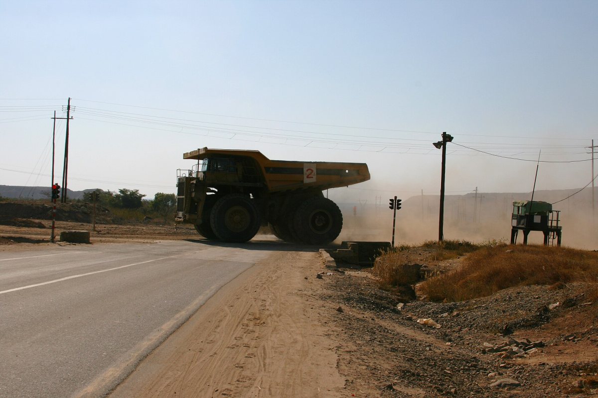 A mining haul truck crossing a road on the Zambian Copperbelt